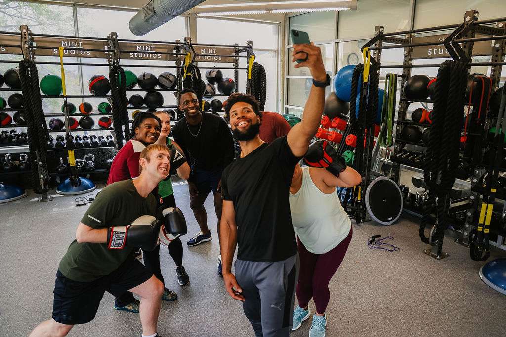 A group of clients taking a selfie with the instructor